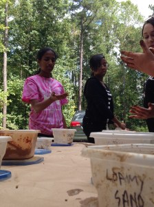 Soil Texture by Feel, Girls becoming comfortable with the different sand, silt, and clay levels.